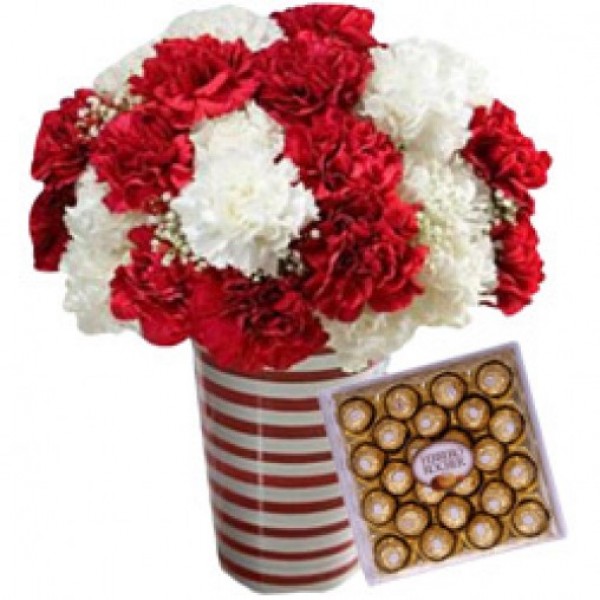 12 Red Carnations and 12 White Carnations with a box of 24 pcs of Ferrero Rocher Chocolates in a Glass Vase